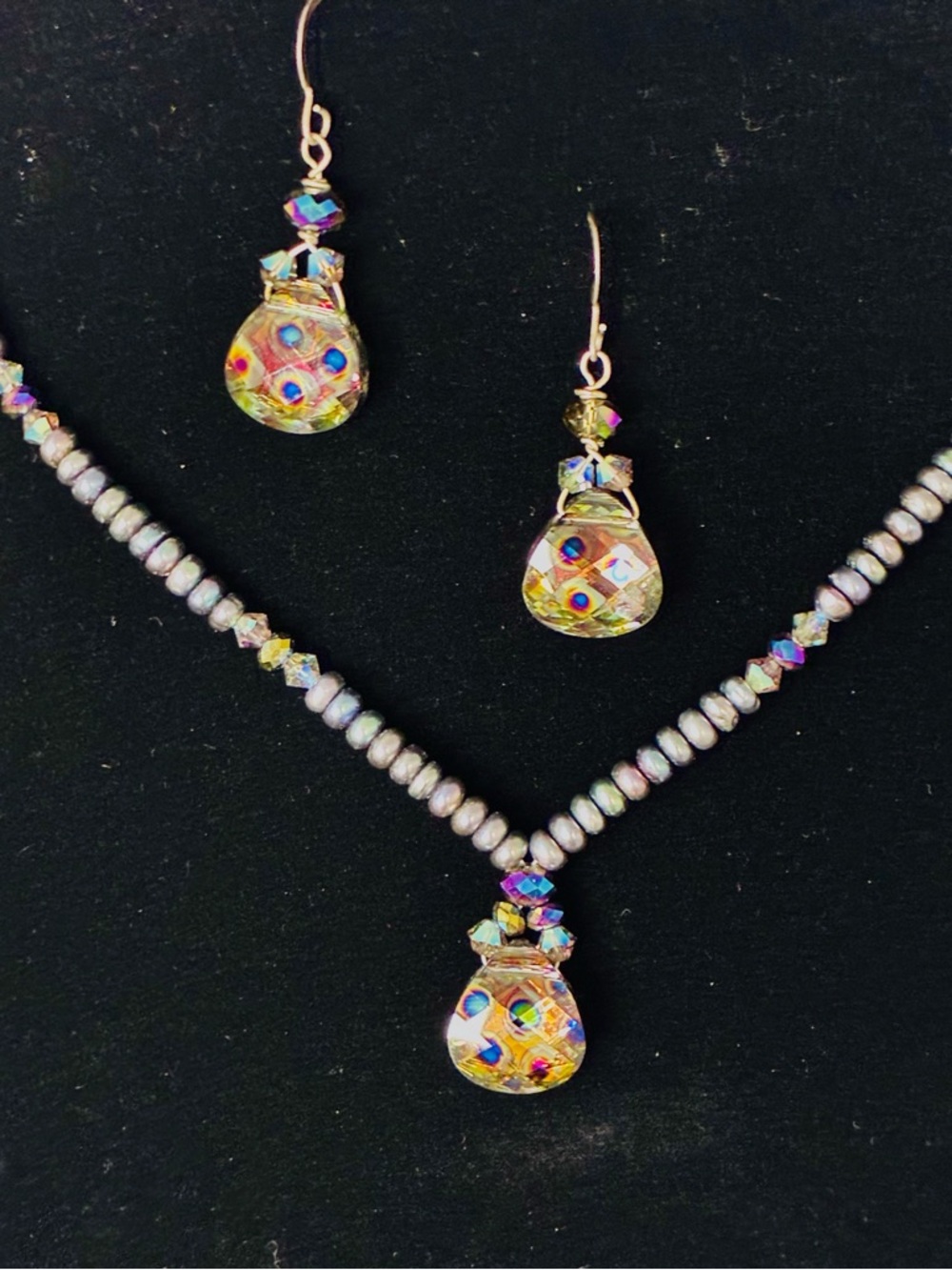 Handcrafted iridescent set featuring a beaded necklace & matching earrings